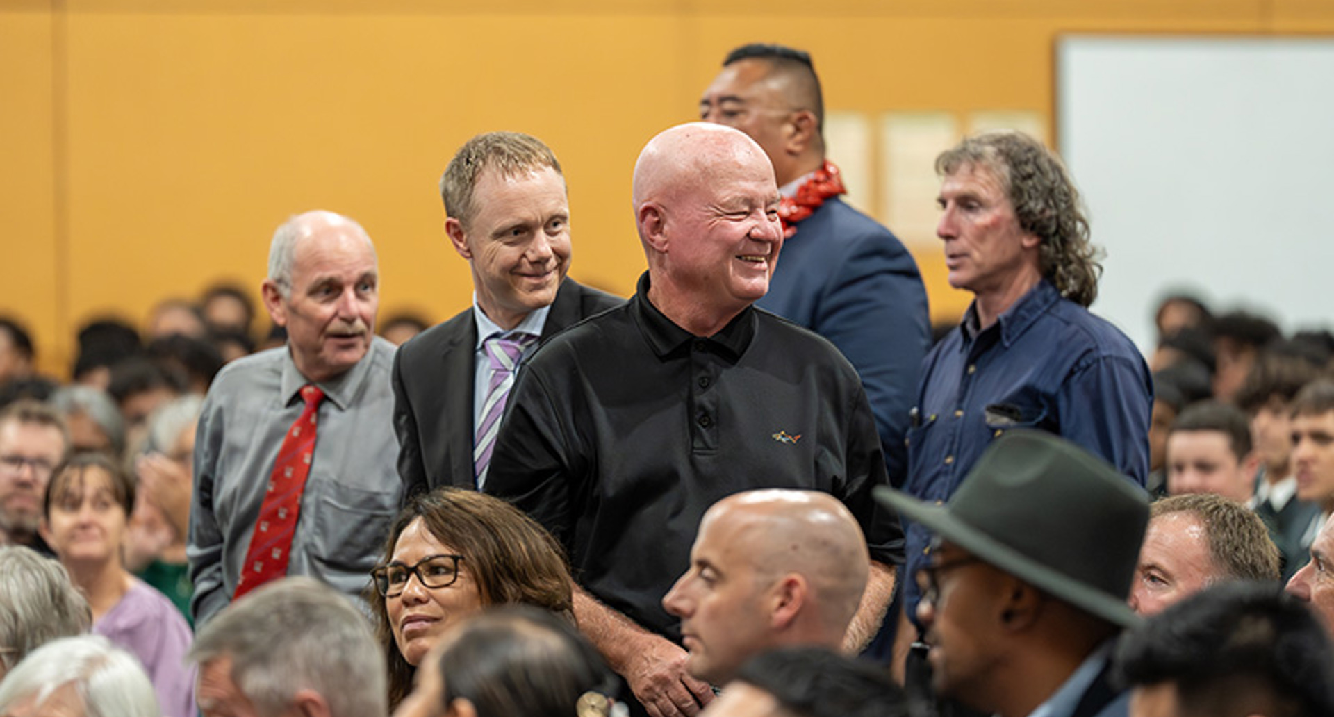 Dilworth Alumni standing in the Dilworth Senior Campus gymnasium