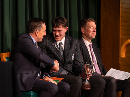 Student shaking the hand of Head of Senior Campus
