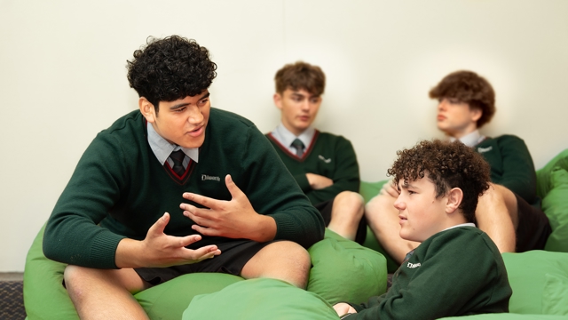 students sitting on bean bags talking 