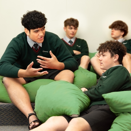 students sitting on bean bags talking 
