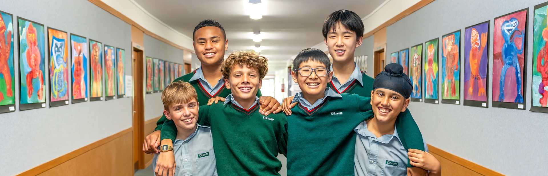 boys standing with each other in a hallway 